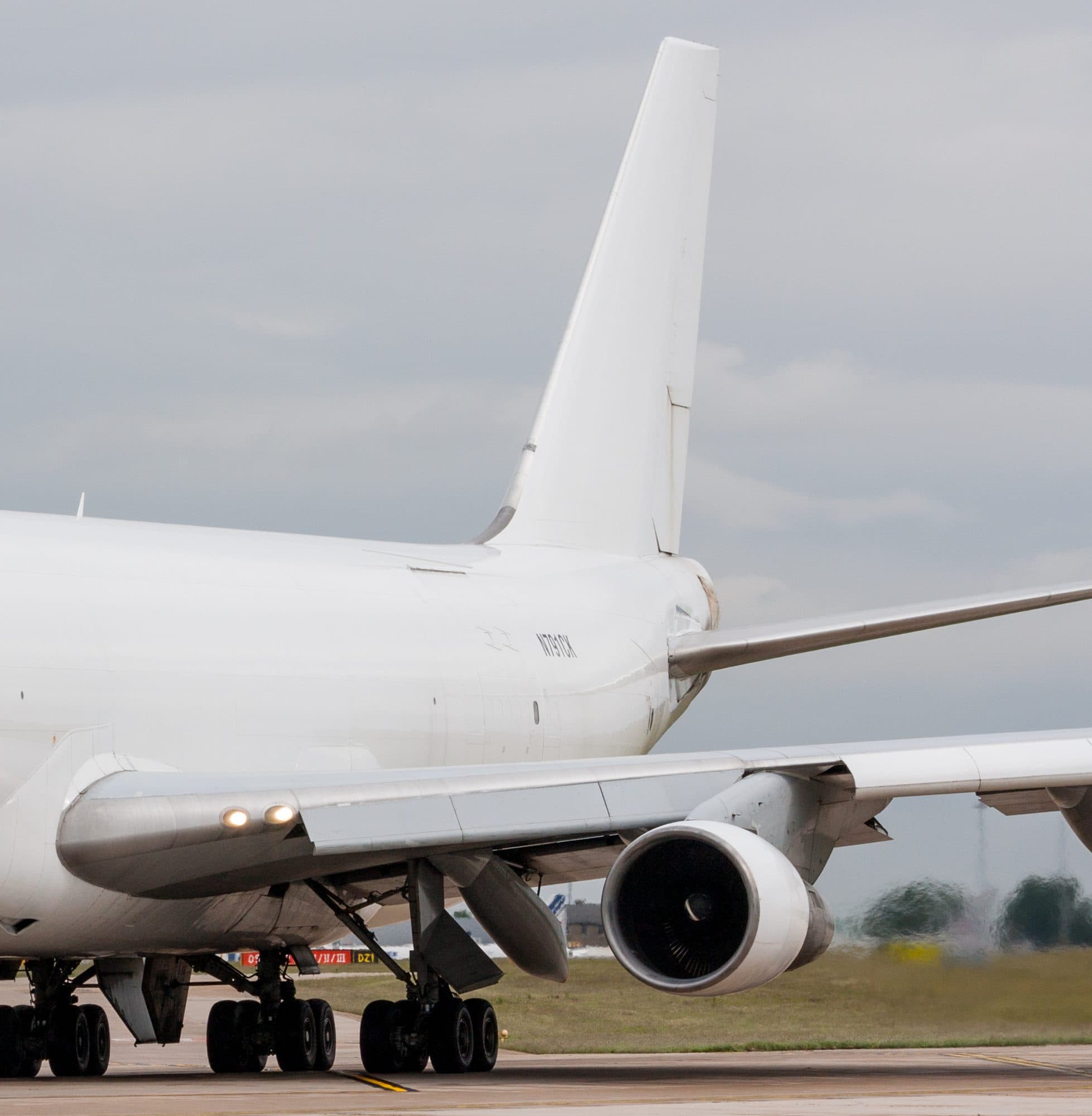A white cargo freighter aircraft on the taxiway